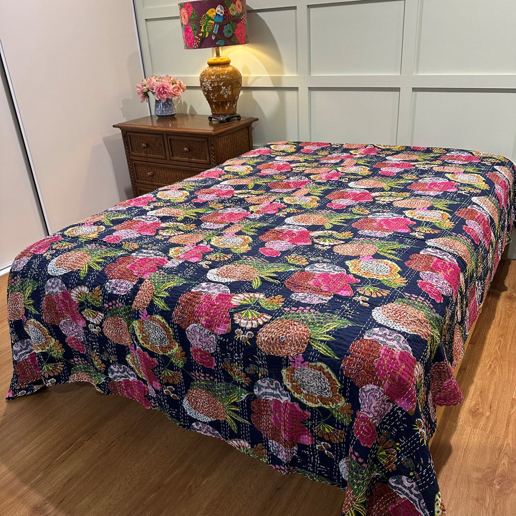 Queen size bedspread on bed