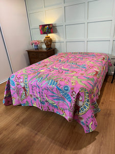 Queen size bedspread on bed