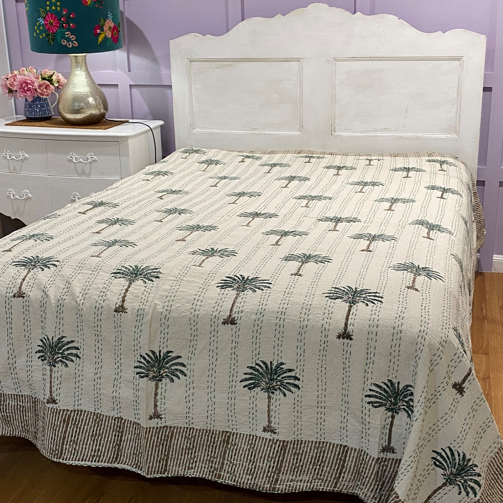 Green Palm Bedspread / Coverlet on bed