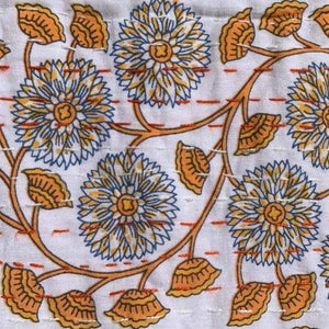 Orange vine baby bedspread close-up