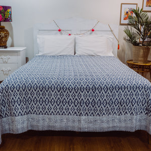 Blue Diamond bedspread on bed